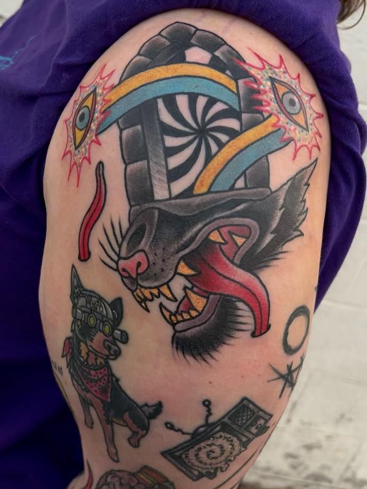 A color neo-traditional panther and mushroom shoulder tattoo